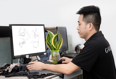 A pattern designer is turning the design into a graphical paper by computer