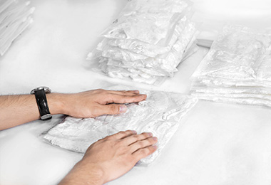 Workers are putting the folded sexy lingerie into the package